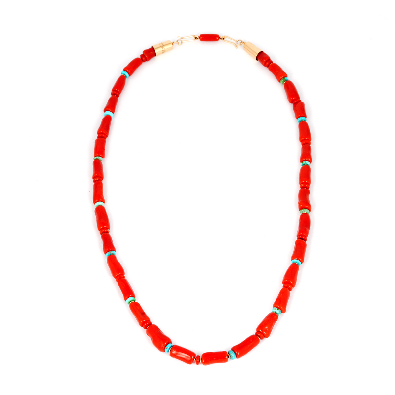 Coral bead necklace by Navajo jeweler Boyd Tsosie features turquoise accents, 14k gold spacers, and a custom gold claps. Accented with turquoise and gold.